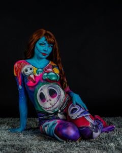 Vibrant body paint with surreal and fantasy themes, featuring vivid colors and artistic makeup.